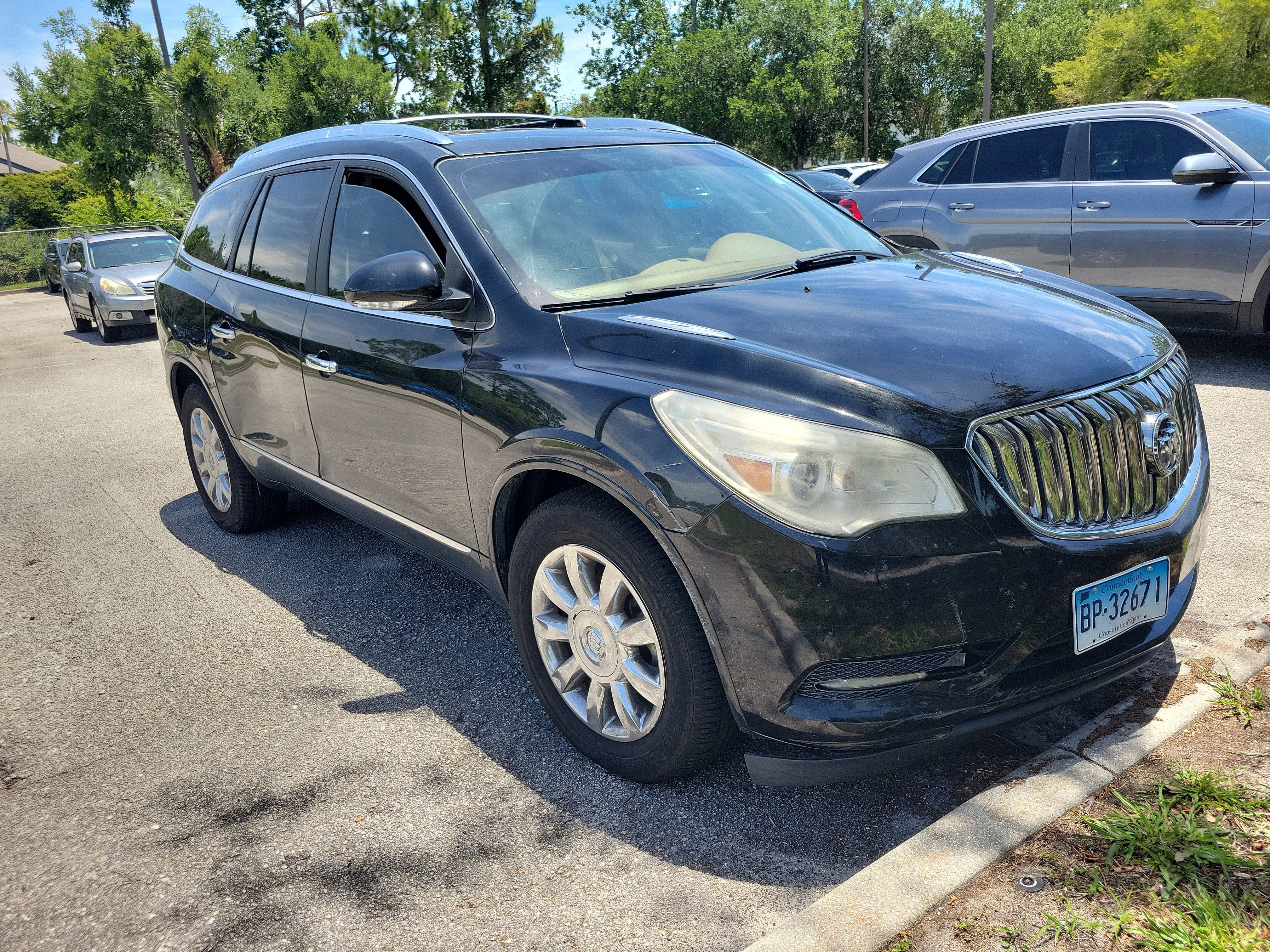 2014 Buick Enclave Leather in Carbon Black Metallic — front three-quarter view